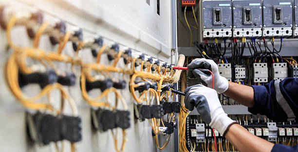 Professional Electrician technician working in Falkville, AL